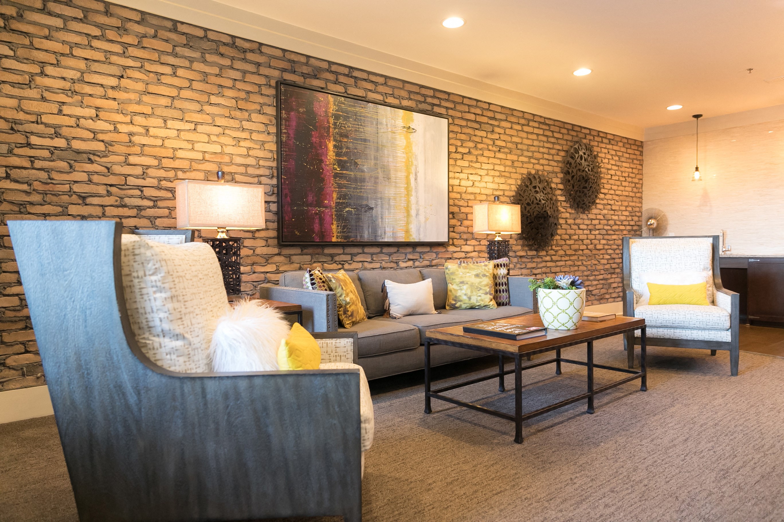 Spacious seating area in a community lounge for residents.